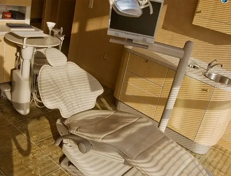 A treatment chair in the sun from a large window.